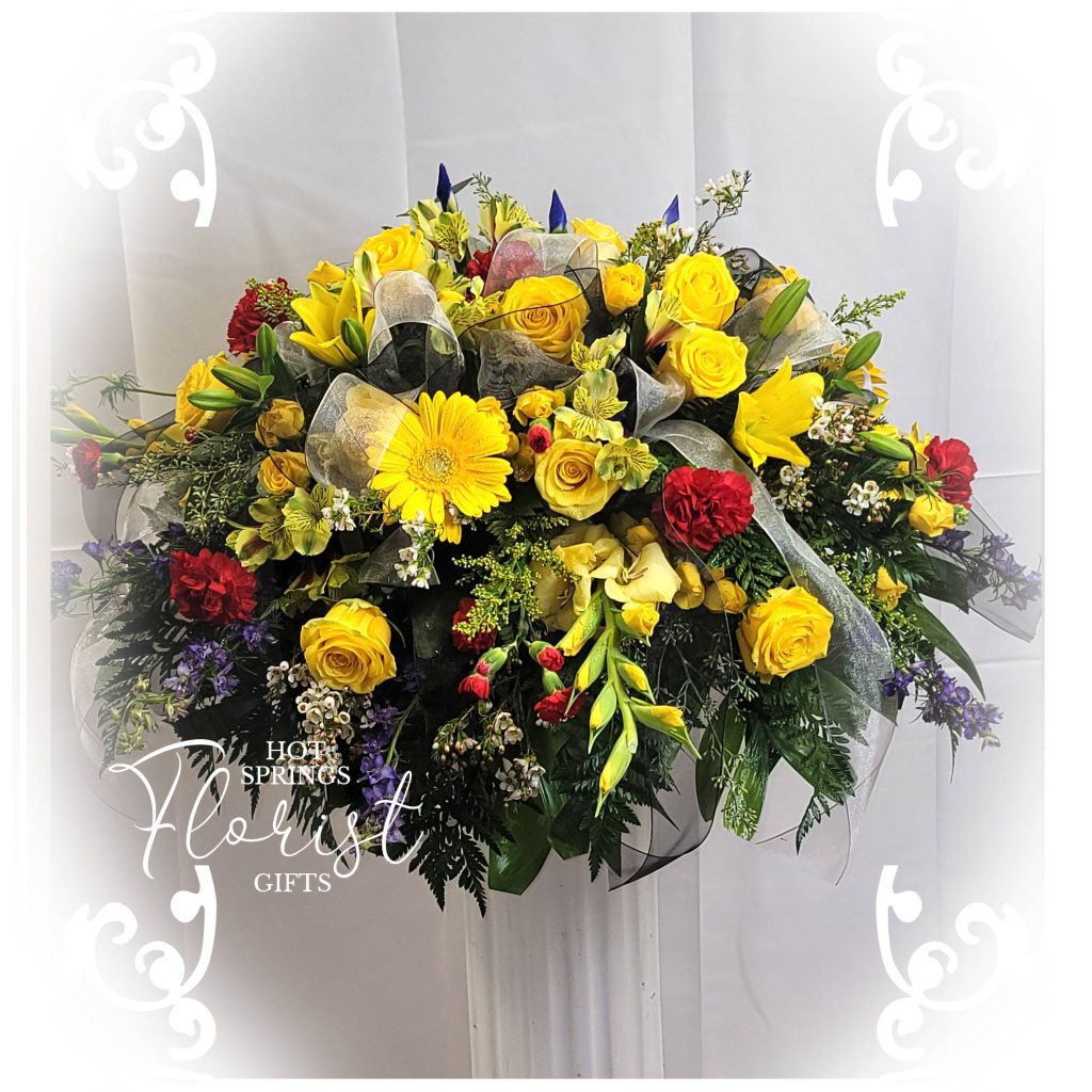 Yellow red casket spray